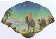 Three diecut board panels, articulating on rivets, with artwork of pilgrims on camels viewing Star of Bethlehem,